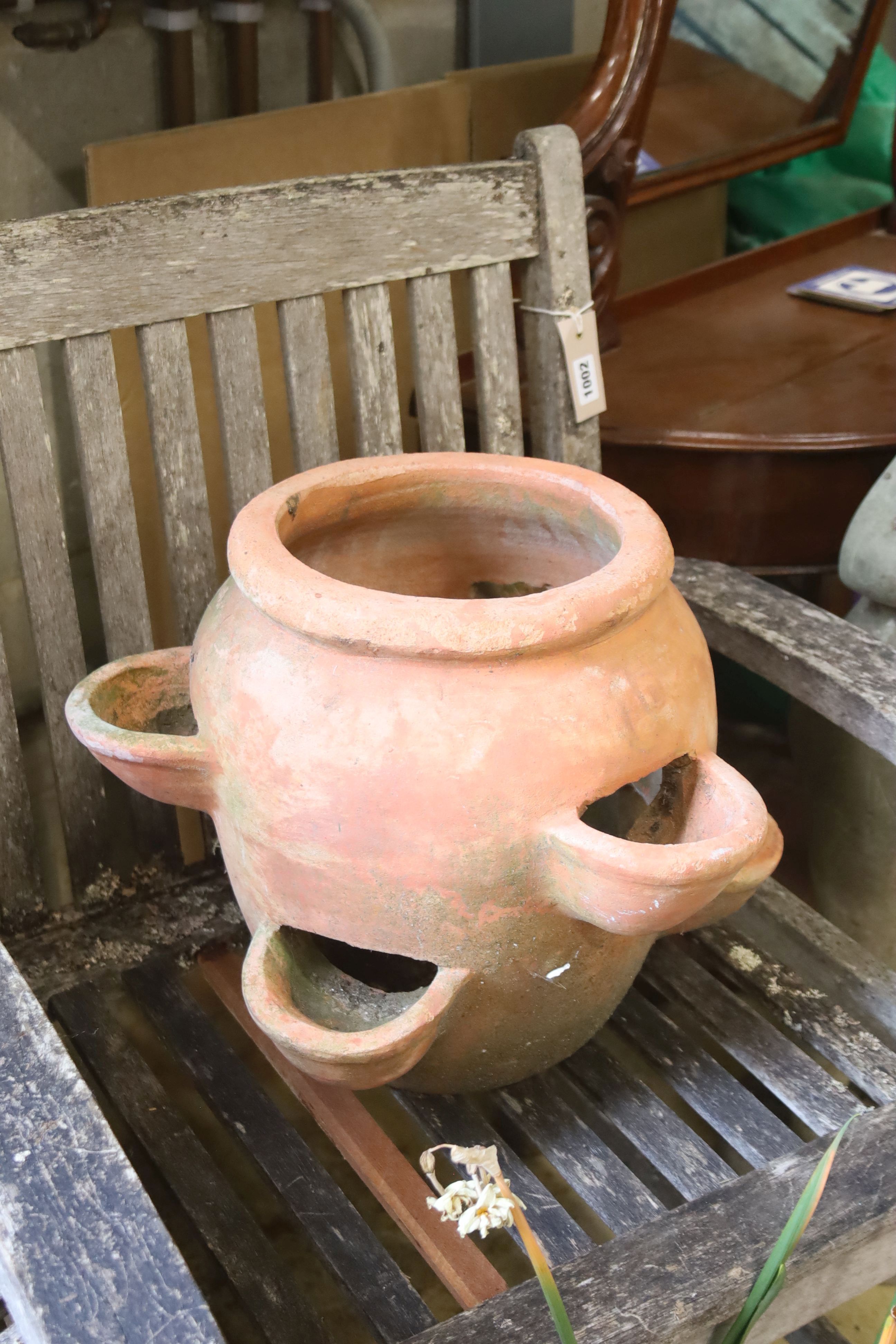 A pair of terracotta garden planters, 40cm diameter, height 32cm